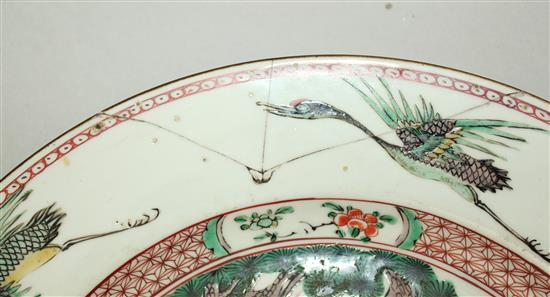A Chinese famille verte deer and crane dish, Kangxi period, 32cm., section broken and re-stuck